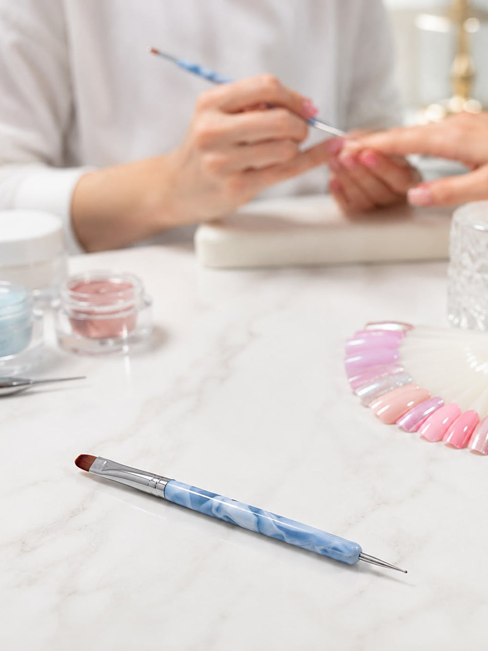 French Nail Art Brush – Marble Handle in professional salon setting