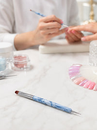French Nail Art Brush – Marble Handle in professional salon setting